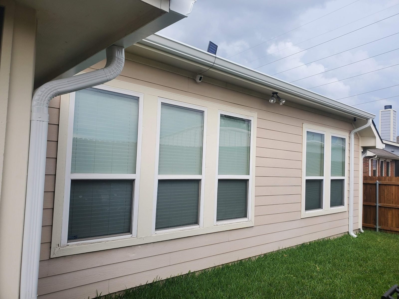 Seamless gutter to downspout outlet detail